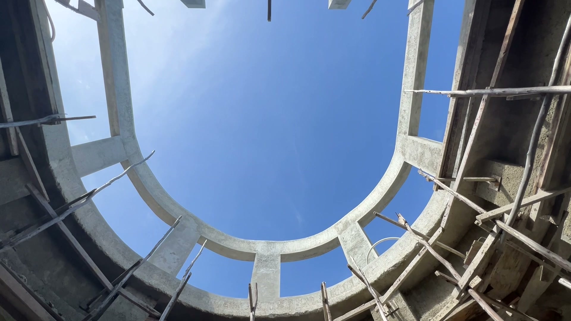 Looking straight up through the open ring of the dome